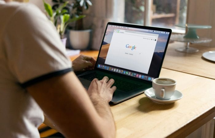 person using black laptop computer on Google search